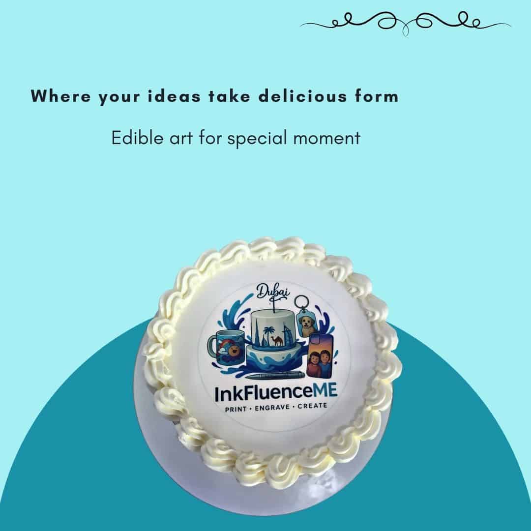 Product image for InkFluenceME edible printing service in Dubai. At the top, the text reads "Where ideas take delicious form" and "Edible art for special moment." The central focus is a round edible print placed on top of a frosted cake, showcasing the InkFluenceME logo, "Dubai" text, and various custom designs including a mug, phone case, and a key chain. The light blue/teal background of the image canvas closely matches the InkFluenceME brand's logo color theme.