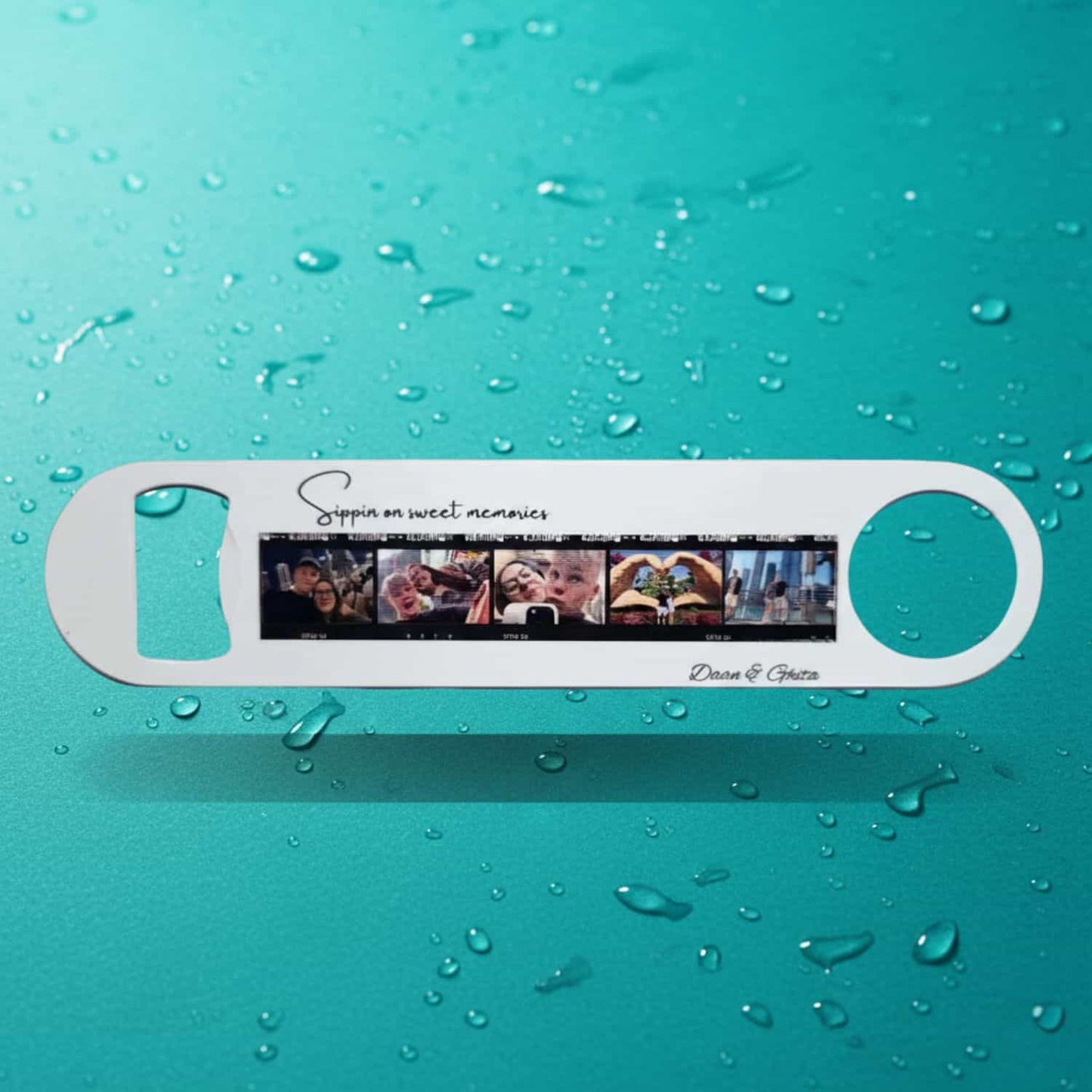 Personalized photo bottle opener featuring a filmstrip of five photos of a couple, with the custom text 'Sippin on sweet memories' and the names 'Daan & Ghita', set on a bright teal background with large water droplets.