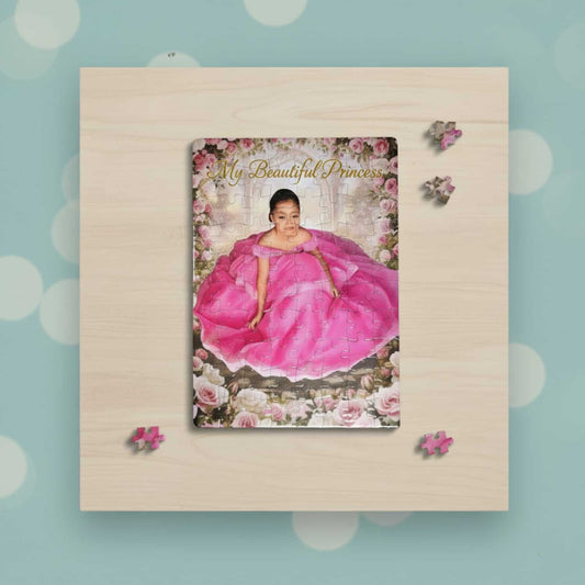Personalized custom puzzle of a young girl in a voluminous pink princess dress sitting in a romantic rose garden setting. The puzzle is laid flat on a wooden tabletop and features the gold overlay text "My Beautiful Princess." A few loose puzzle pieces are scattered around the main, completed puzzle, emphasizing the interactive use and high-quality photo printing of the personalized picture gift.