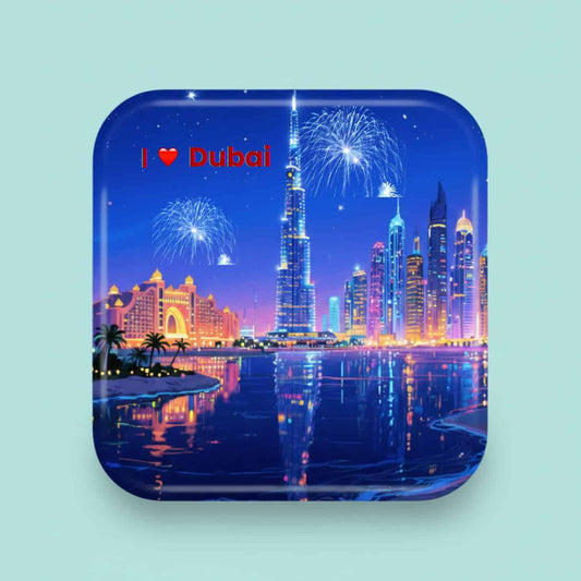 InkFluenceME personalized rounded square magnet showing a vibrant, sparkling Dubai skyline at night with fireworks over the Burj Khalifa and 'I ❤️ Dubai' text in red.