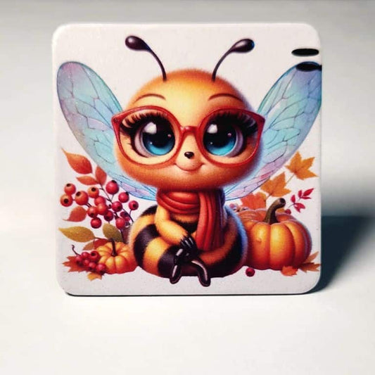Custom 6.5cm rounded square magnet featuring a cute cartoon bee in glasses with an autumn theme of pumpkins and fall leaves.